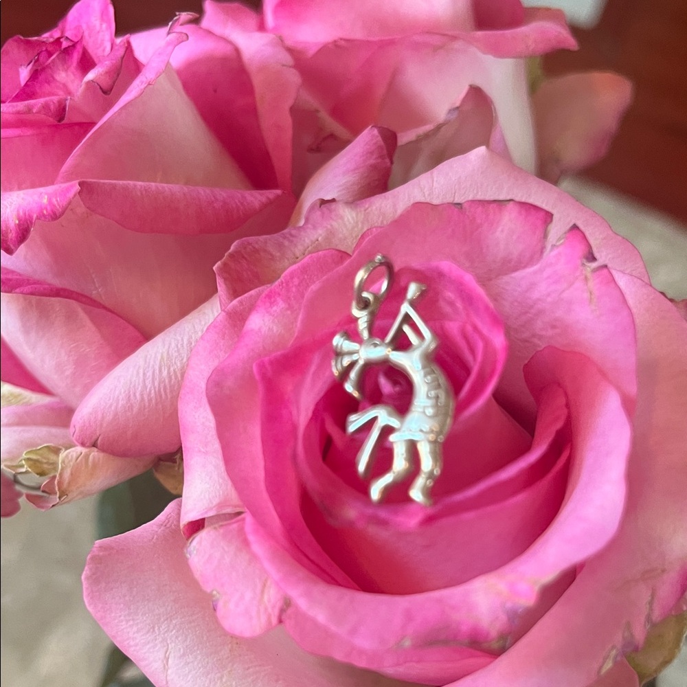 Kokopelli сharm, featuring the Native American flute player symbol.